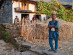 A Tamang farmer in front of his home