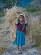 A young Tamang girl helps with the harvest, Okhreni