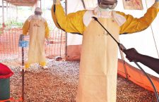 The decontamination process at one of MSF’s Ebola Management Centres, Magburaka, Sierra Leone, March 2015