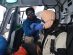 Dr Suvash applying direct pressure to a bleeding head wound on a climber injured by a falling object