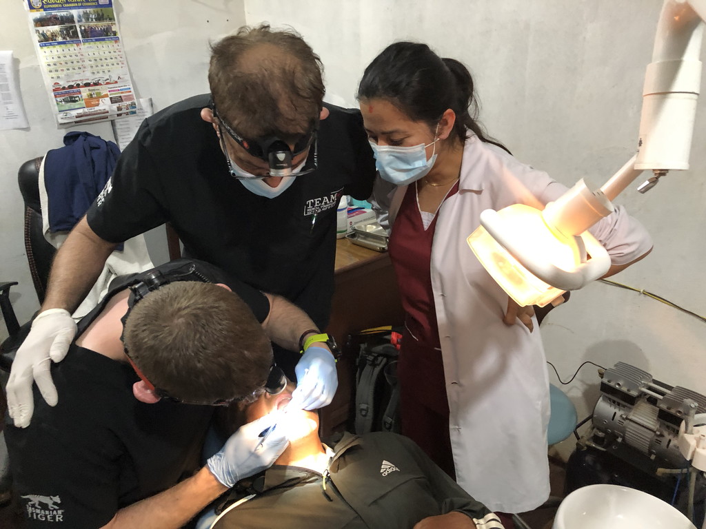 Expedition dentists treating a patient